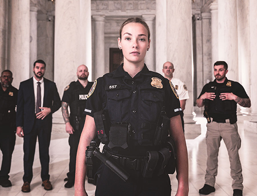 police officers standing in front of a building